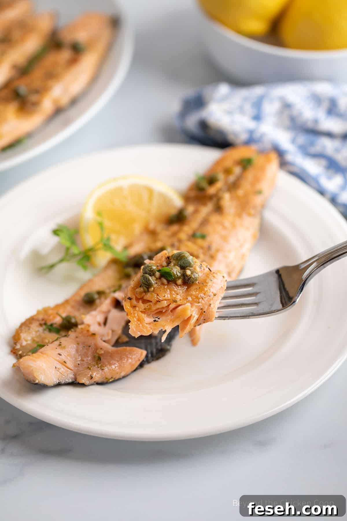 A fork with a bite of trout.