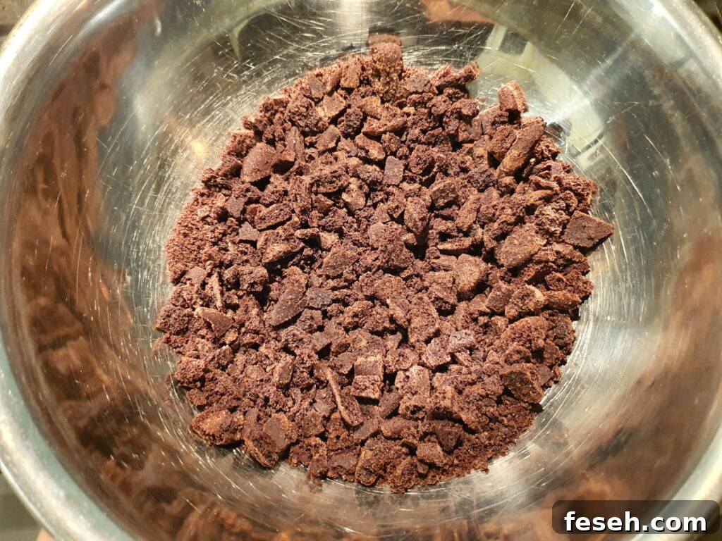 Oreos crushed up quite fine in a bowl, with pieces ¼ inch big or smaller.