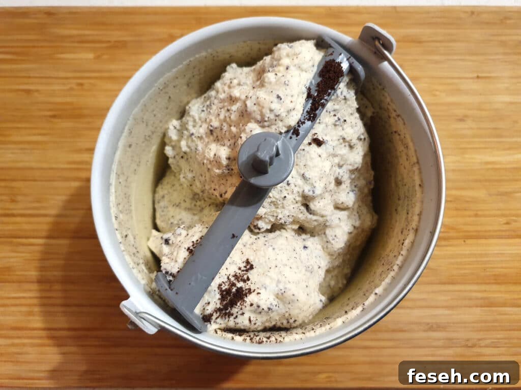 Churned ice cream in churning bowl.