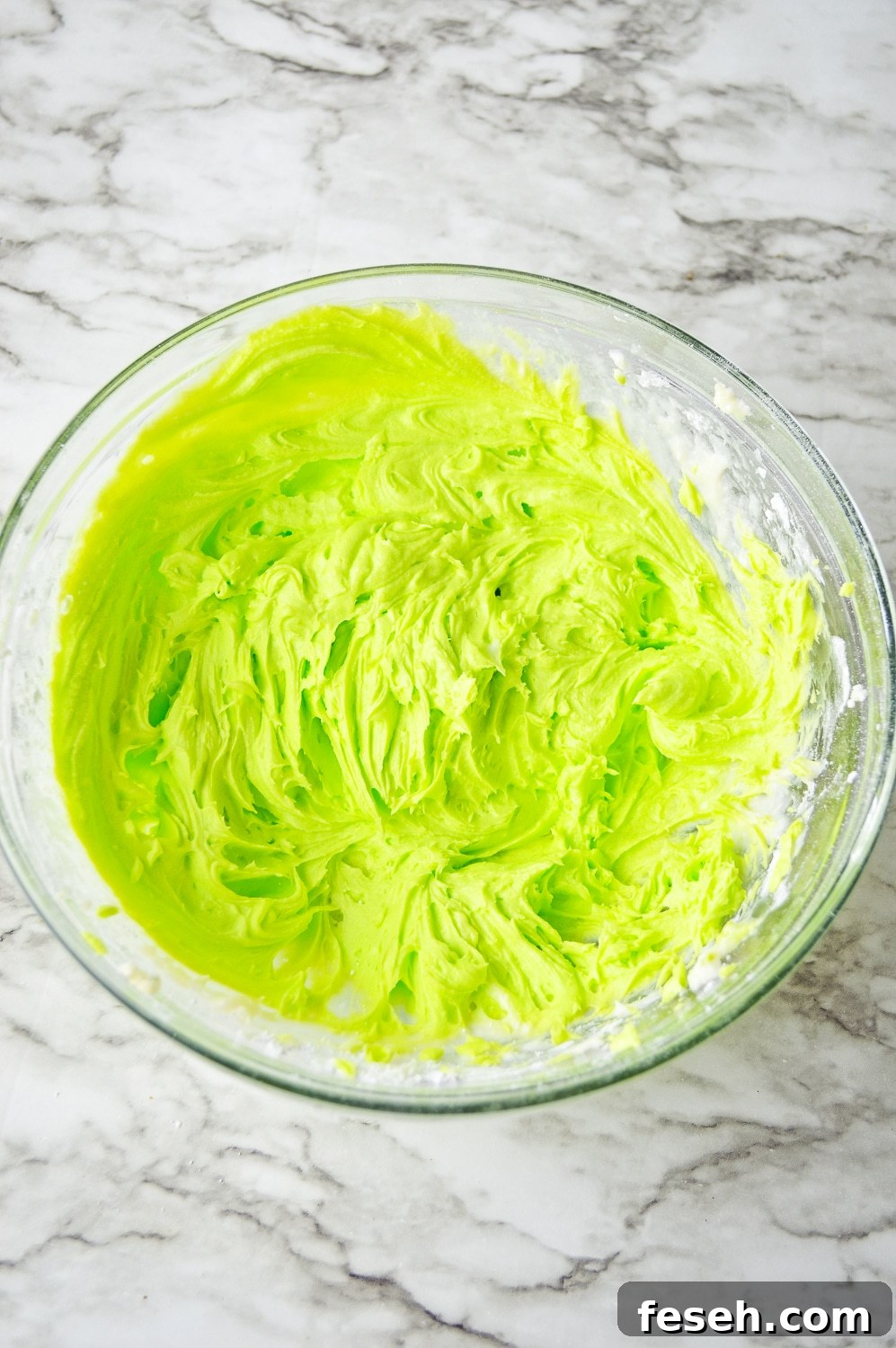Christmas green icing in a bowl