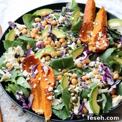 superfood spinach salad with wooden serving set and white napkin