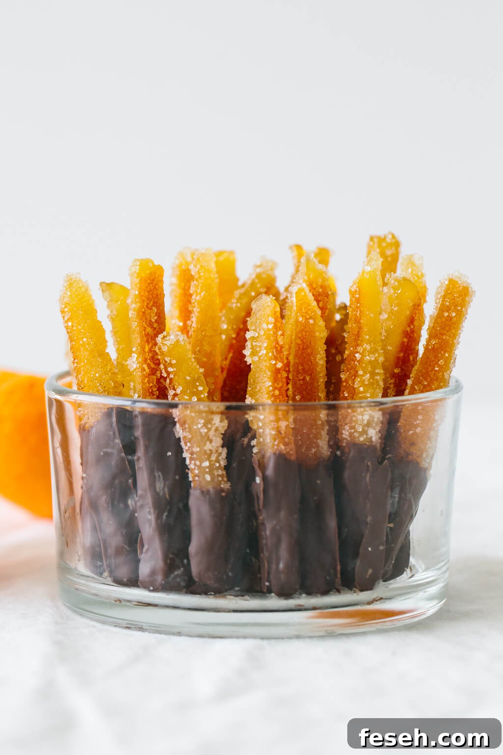 Candied orange peel is the perfect sweet treat. It's slightly bitter with a burst of orange and deliciously sweet.