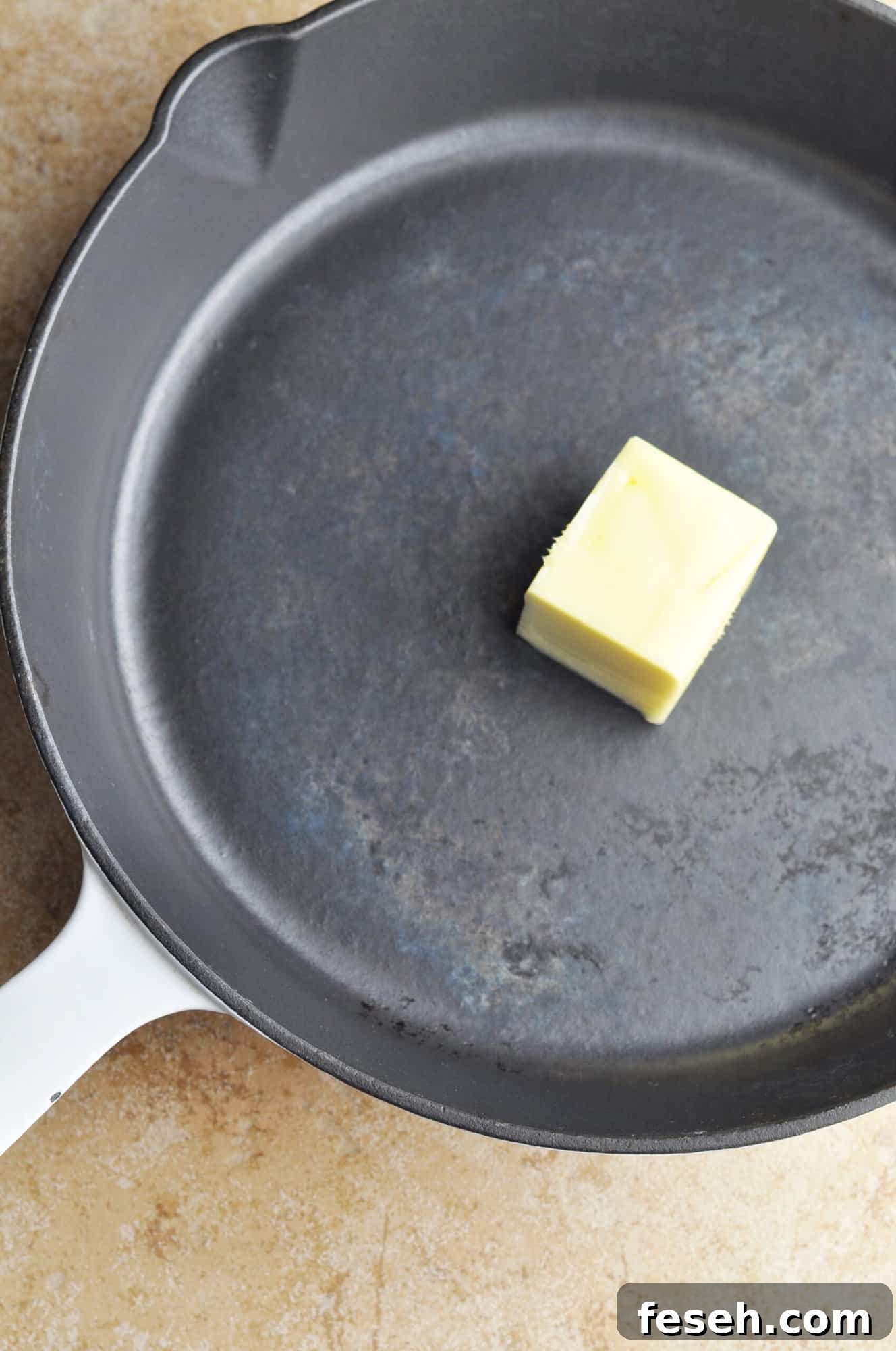 Unmelted butter in cast iron skillet.