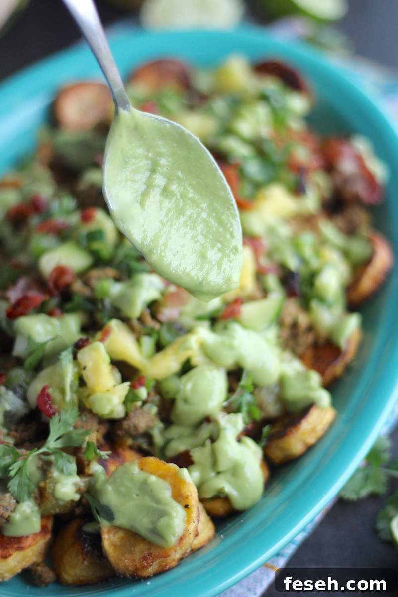 Loaded Tropical Plantain Nachos (AIP, Paleo) - a healthier take on traditional nachos, but with a TON of flavor, thanks for pineapple salsa, avocado lime crema, and crispy bacon! | fedandfulfilled.com