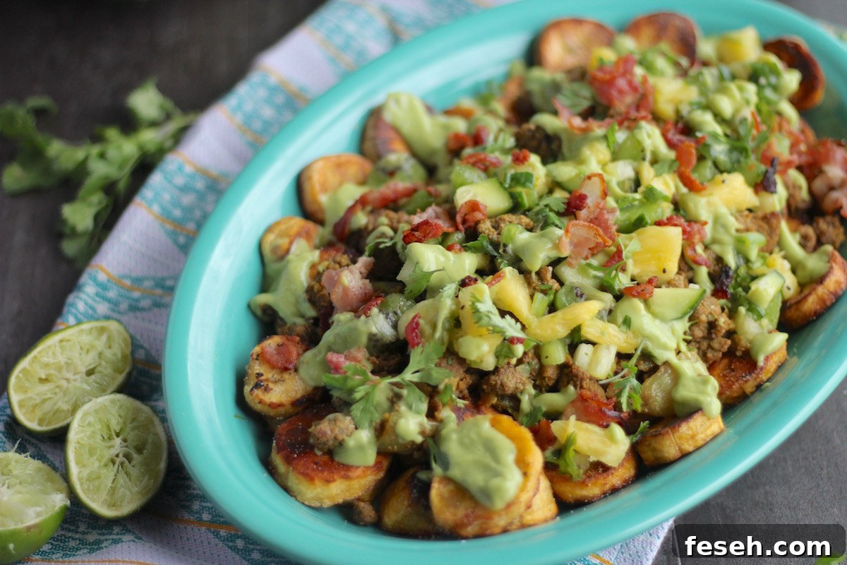 Loaded Tropical Plantain Nachos (AIP, Paleo) - a fresh, no-bake take on nachos! With savory plantains, crispy bacon, pineapple kiwi salsa, and avocado lime crema! | fedandfulfilled.com