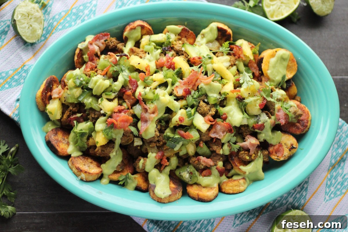 Loaded Tropical Plantain Nachos (AIP, Paleo) - colorful, healthy nachos made with savory garlic plantains, grassfed beef, bacon, pineapple kiwi salsa, and avocado lime crema! | fedandfulfilled.com