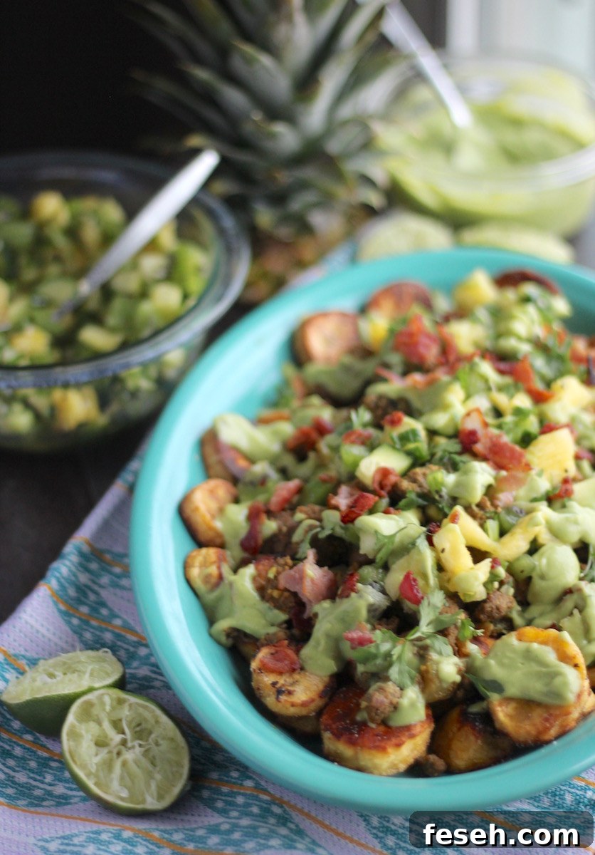 Loaded Tropical Plantain Nachos (AIP, Paleo) - a refreshing, tropical take on nachos, featuring plantains, pineapple kiwi salsa, and avocado lime crema! | fedandfulfilled.com