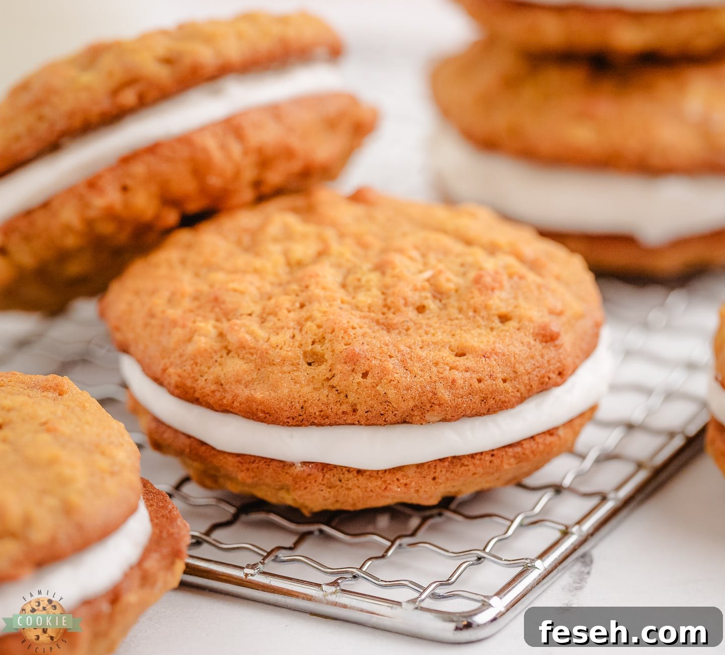 pumpkin oatmeal sandwich cookies on a cooling rack