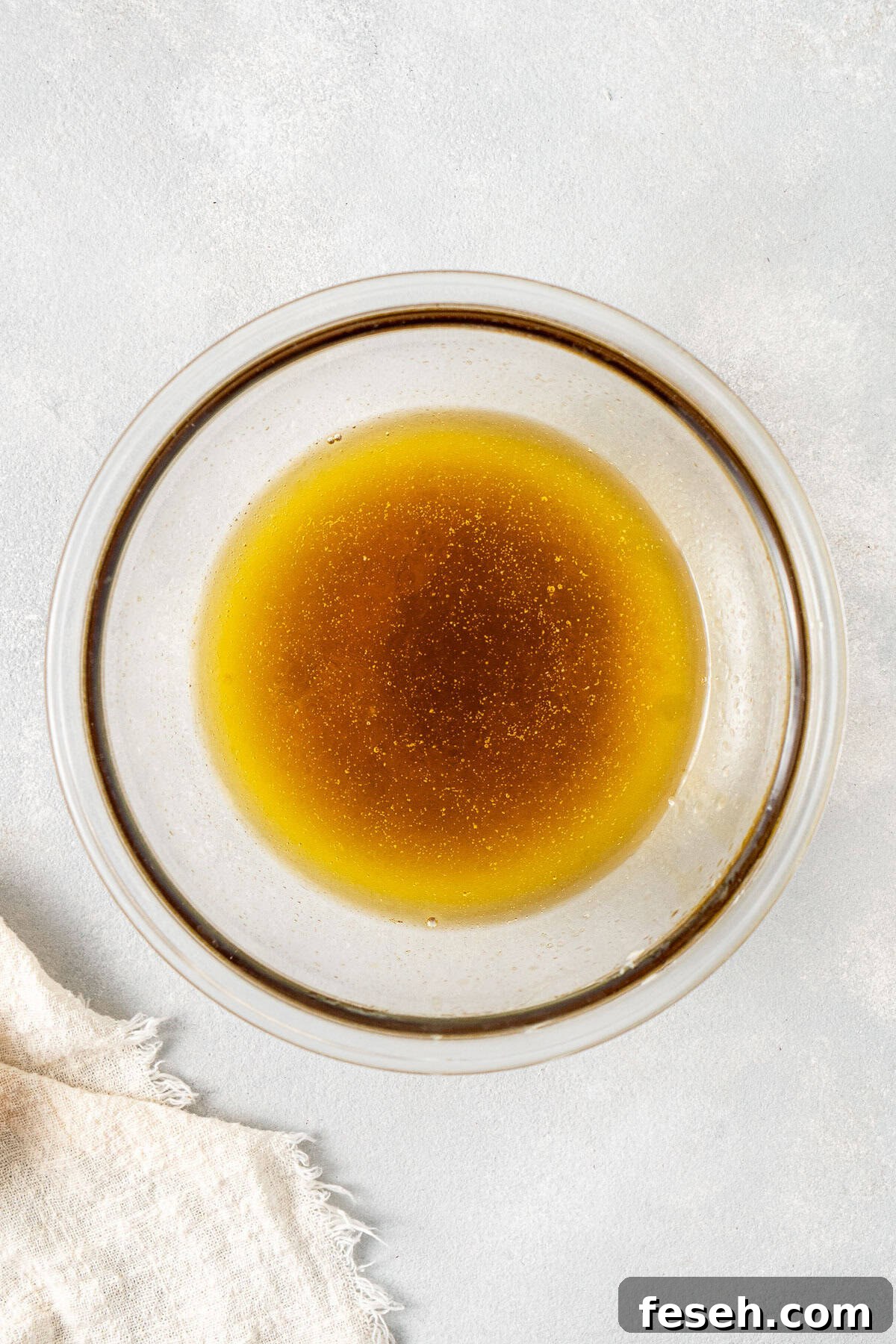 Melted dairy free butter and golden syrup in a bowl.
