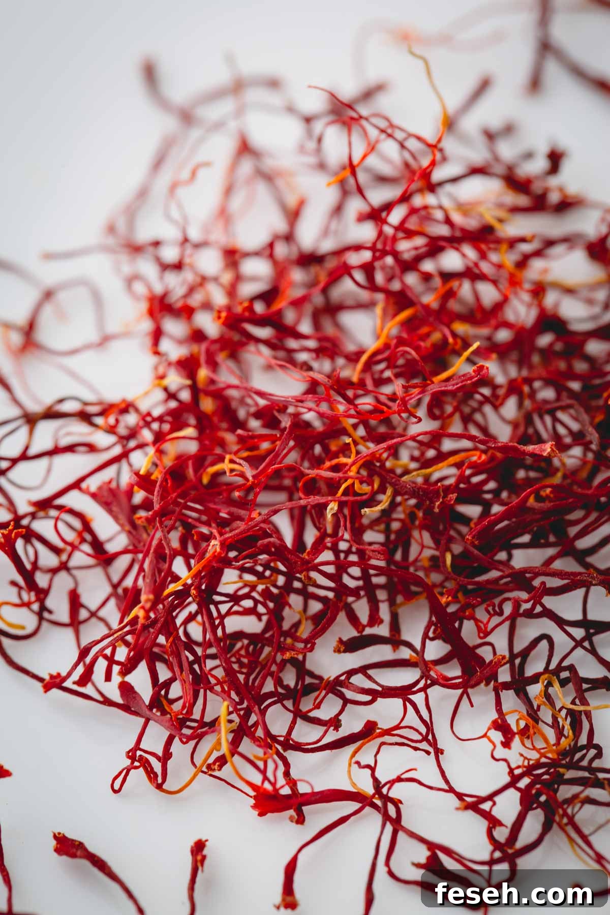 Strands of saffron on a white background.