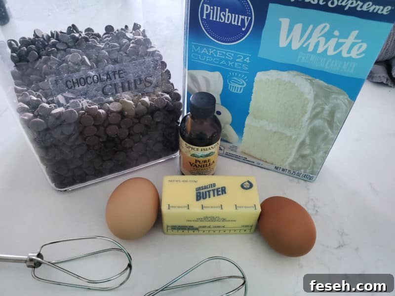 Chocolate Chip Cake Mix Cookies ingredients, chocolate chips, eggs, butter, vanilla, and cake mix