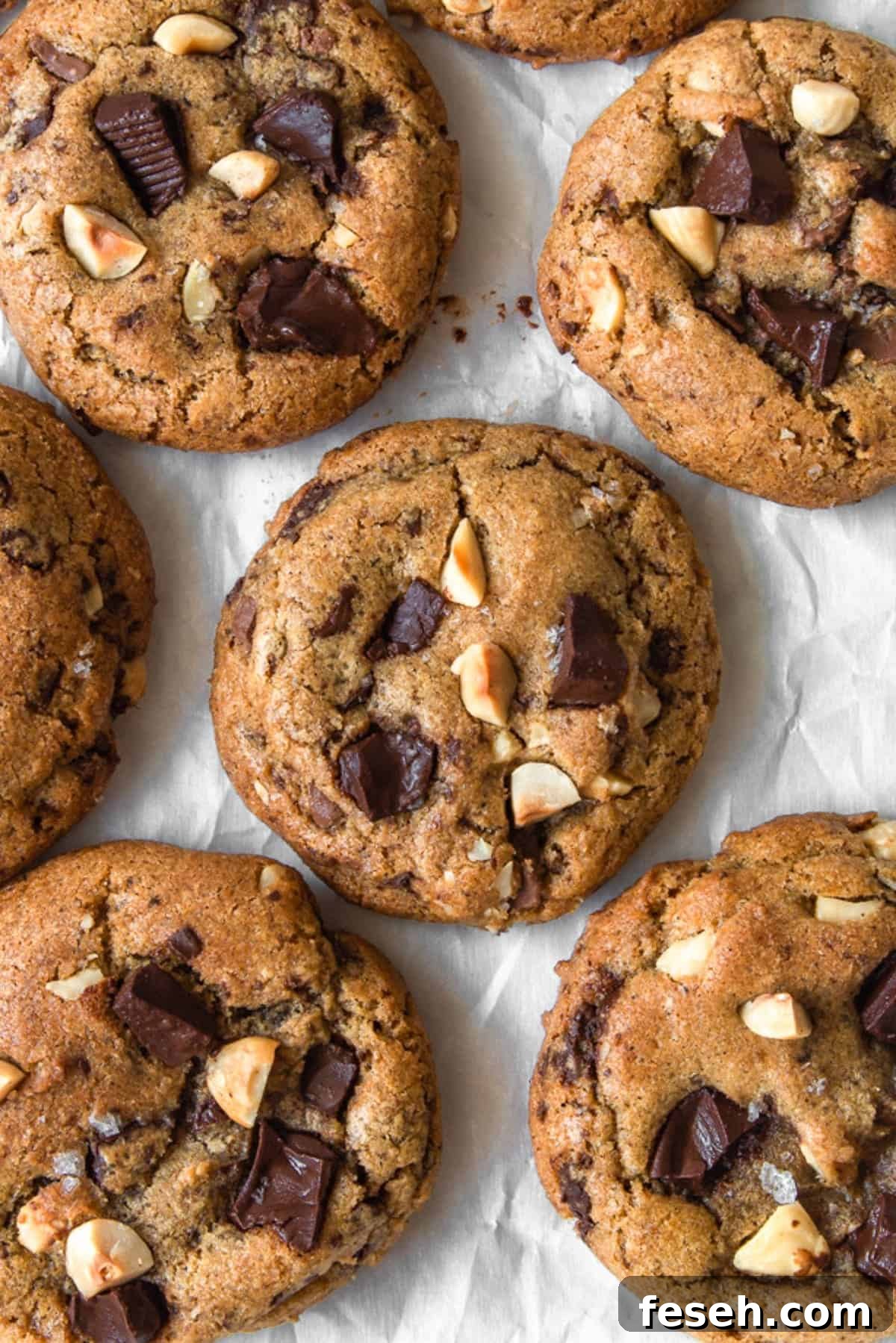 Overhead shot of browned butter chocolate chip cookies on parchment paper.