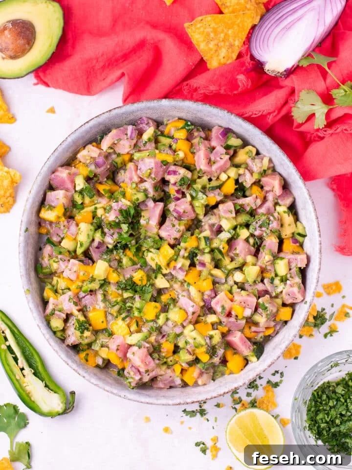 large gray bowl with tuna ceviche, mango, avocado and cilantro