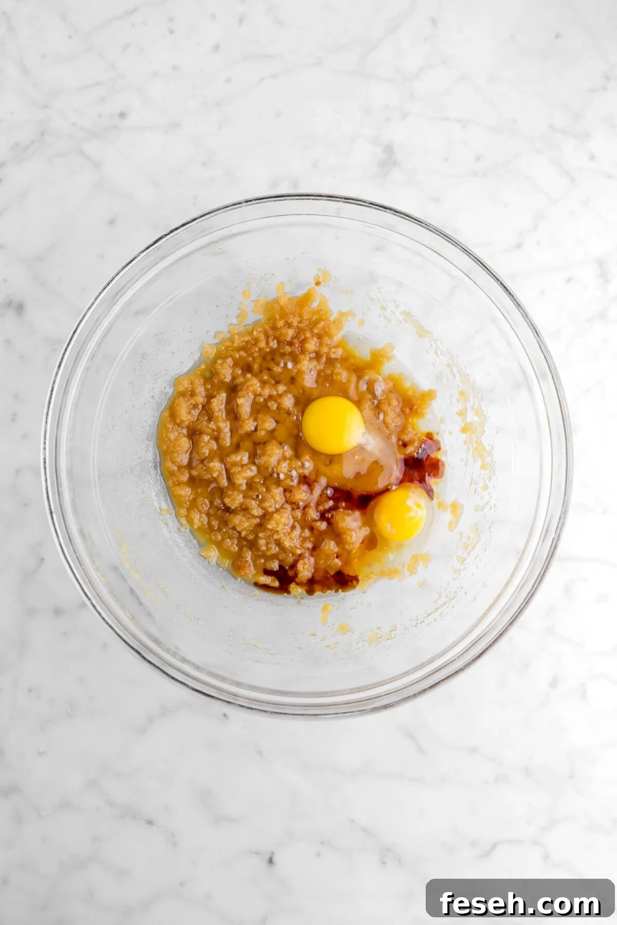 egg and vanilla added on top of sugar mixture.