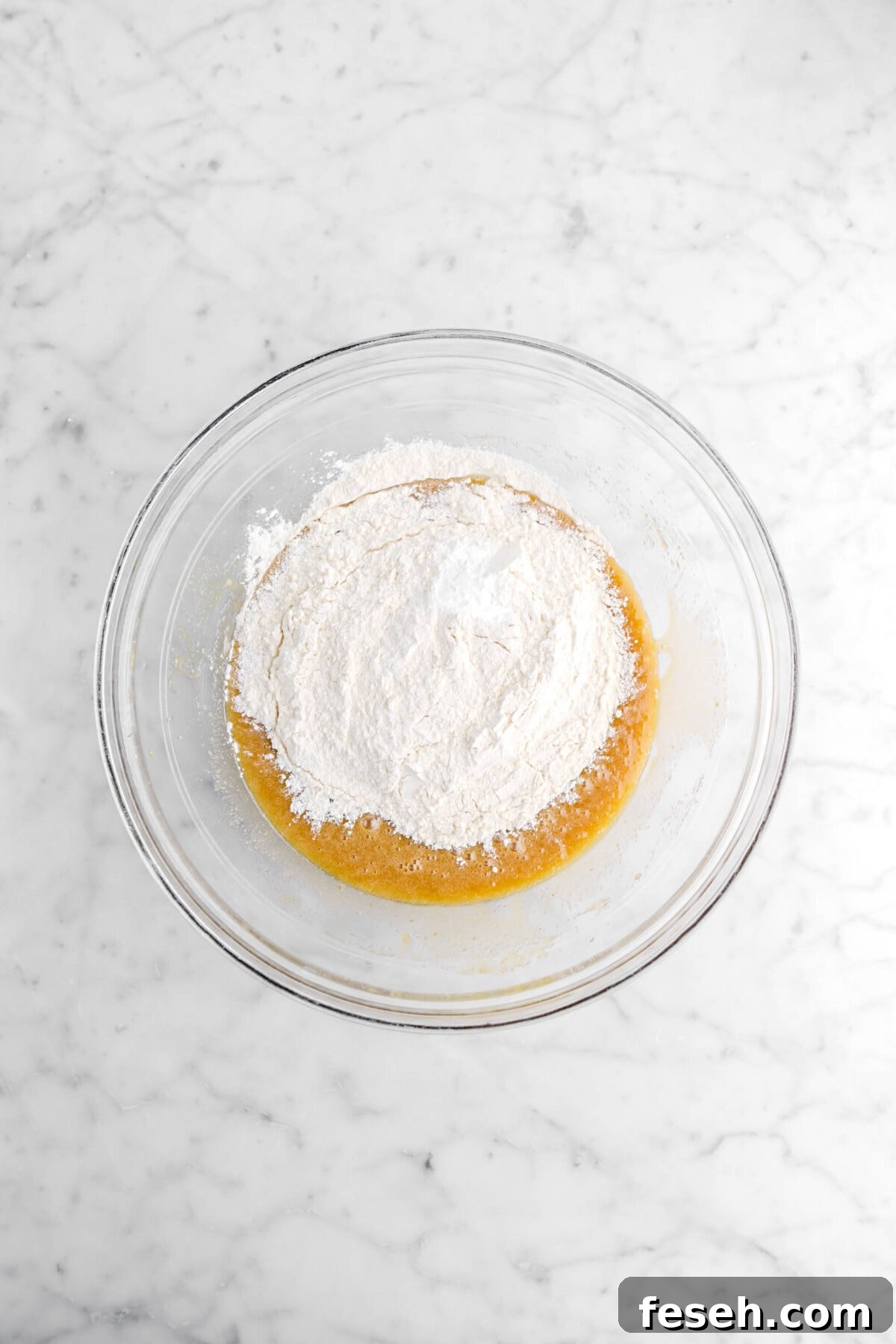 flour and baking soda added to sugar and egg mixture.