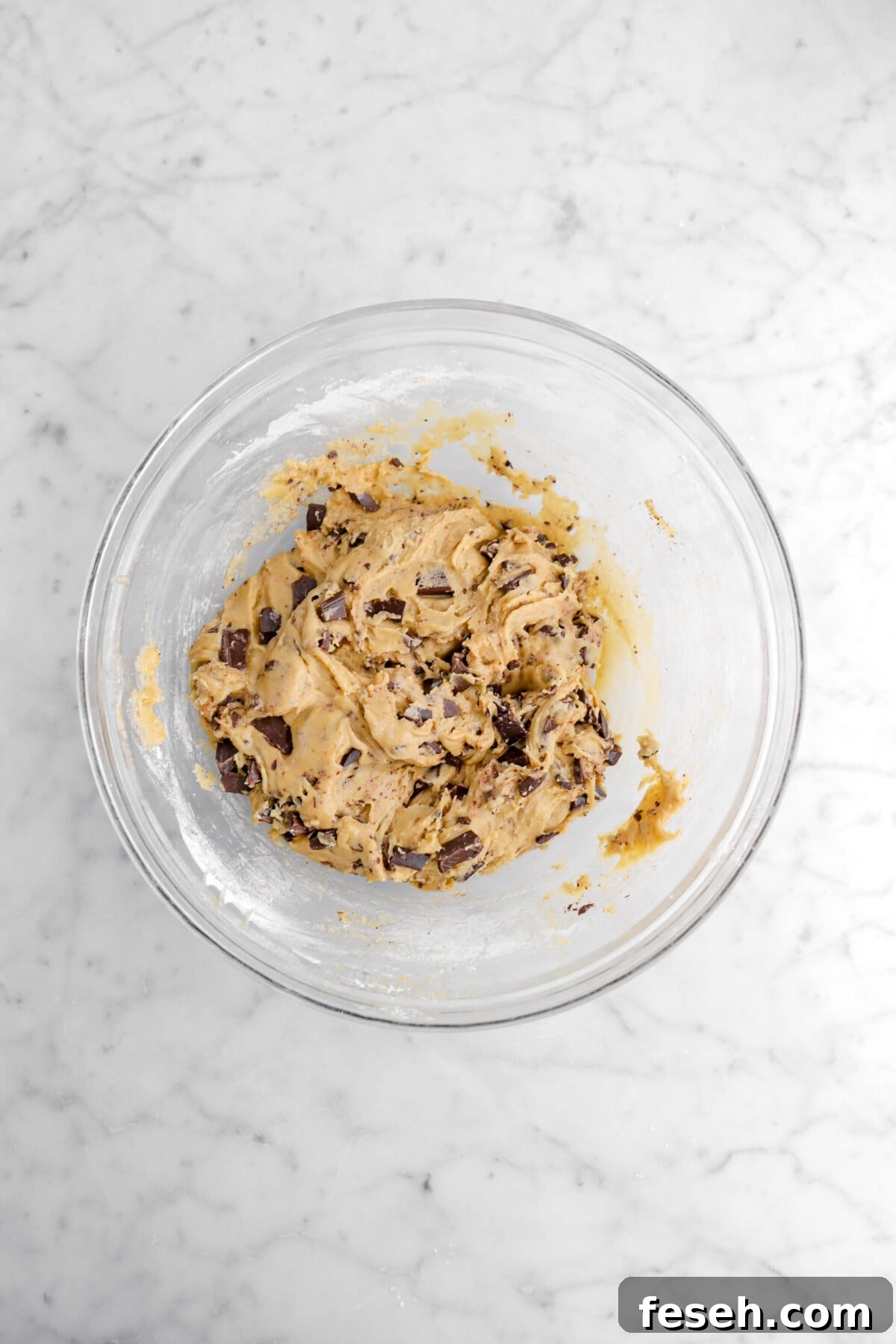 chocolate chip cookie dough in glass bowl.