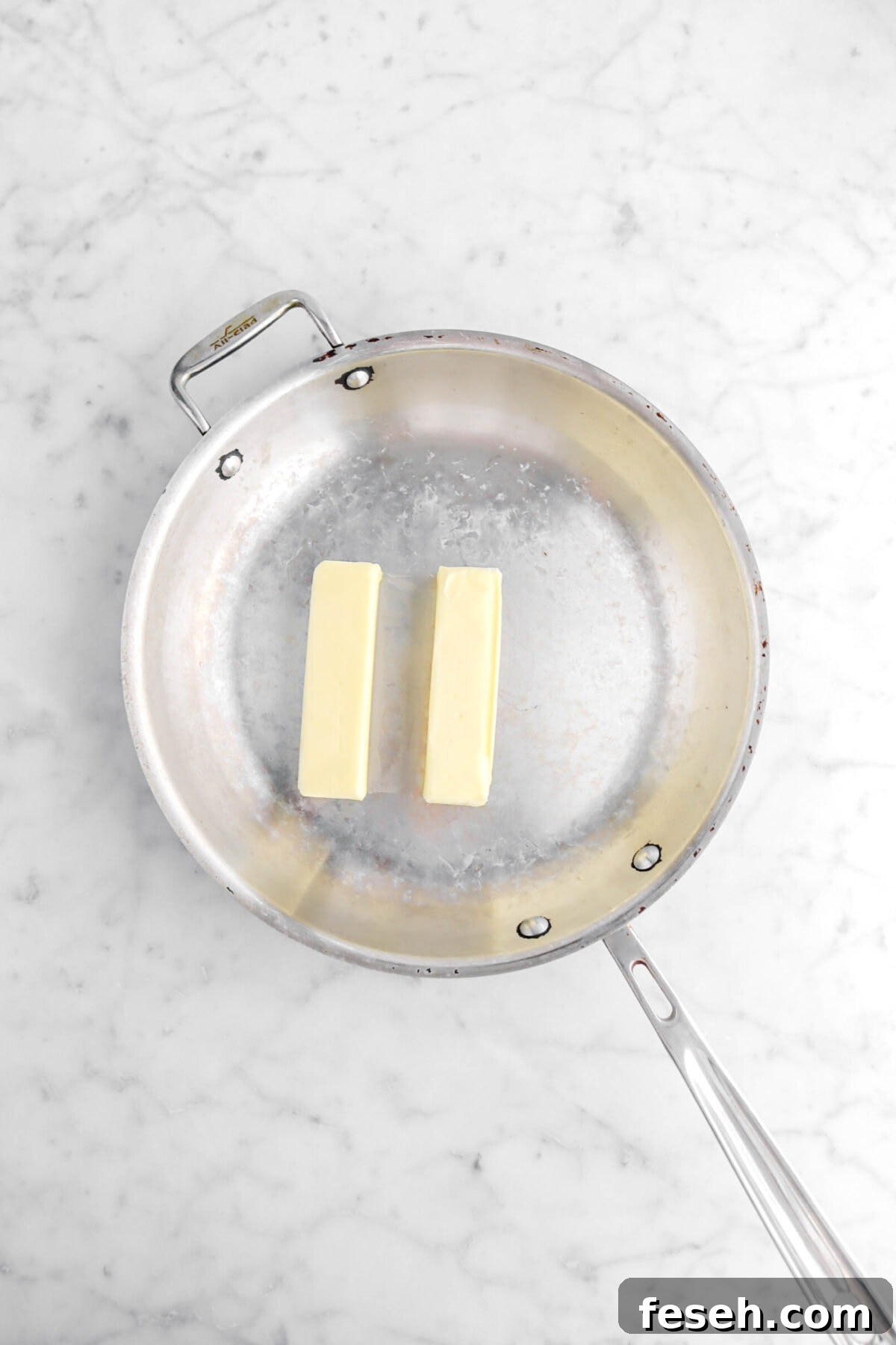 two sticks of butter in a skillet.
