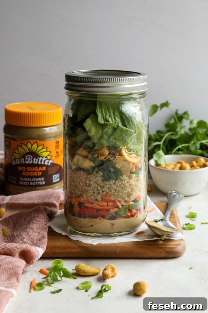 Thai Mason Jar Salads on board with cashews and cilantro in background 