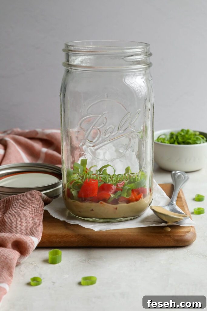 SunButter dressing in mason jar with bell pepper and green onion