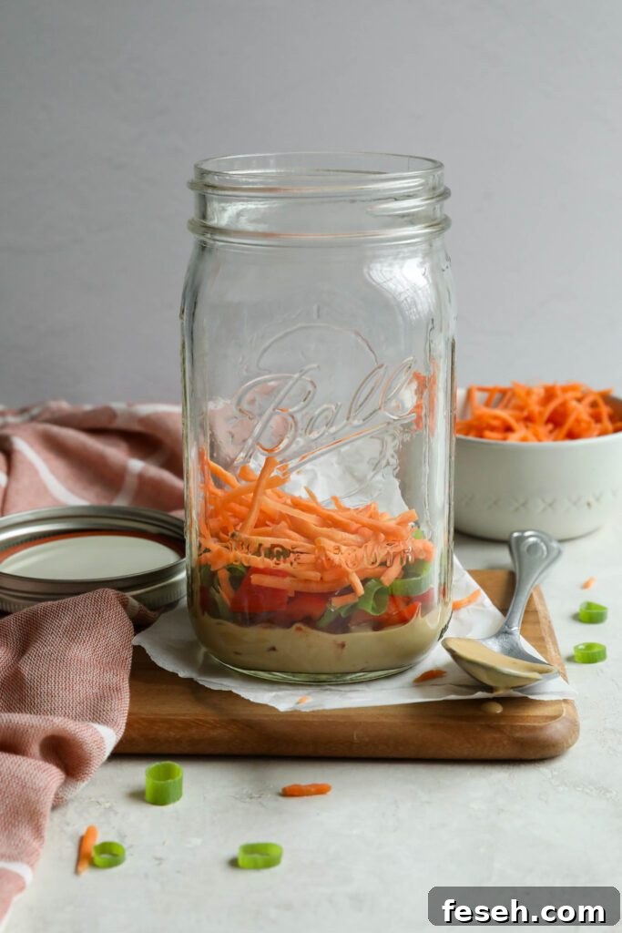 SunButter dressing in jar with bell pepper, green onion, and carrots