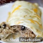 Smothered sweet pork burrito on a white plate with a bite on a fork