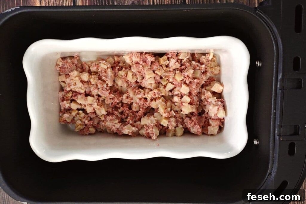 place corned beef hash and dish in air fryer basket