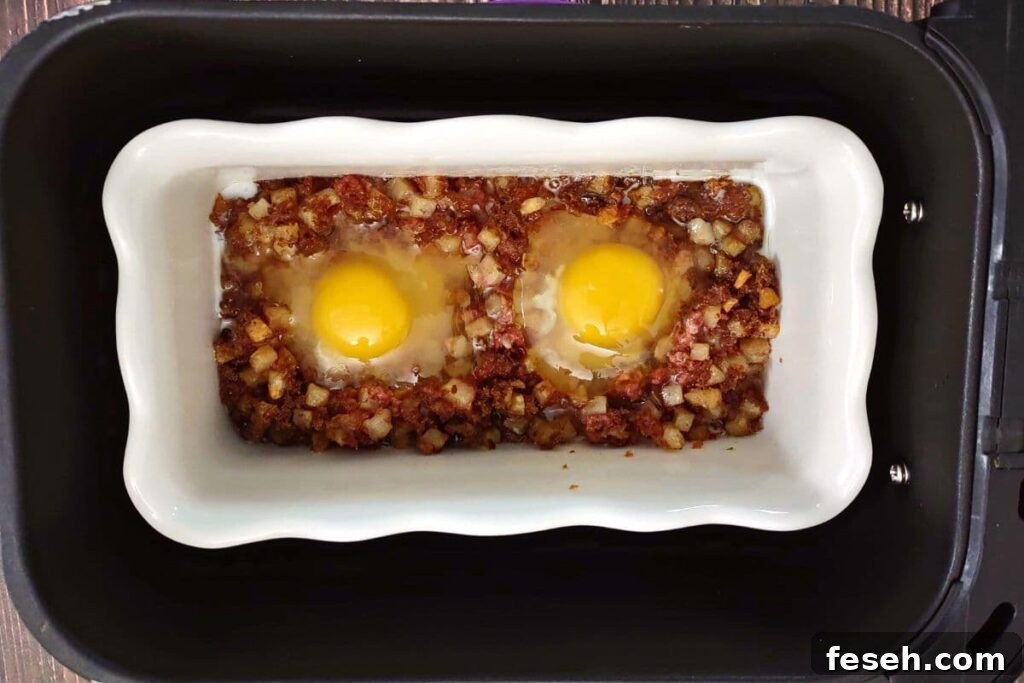 add eggs to the open spots in the corned beef hash