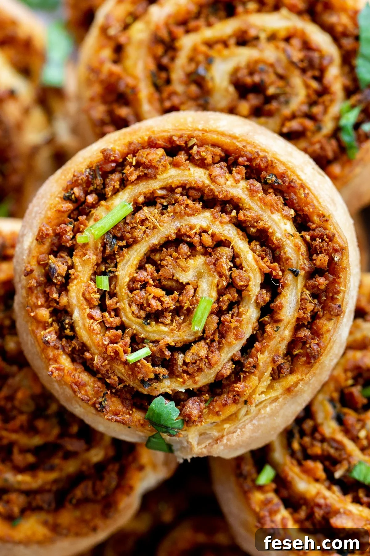 close up of a platter of puff pastry pinwheels with lentil filling 
