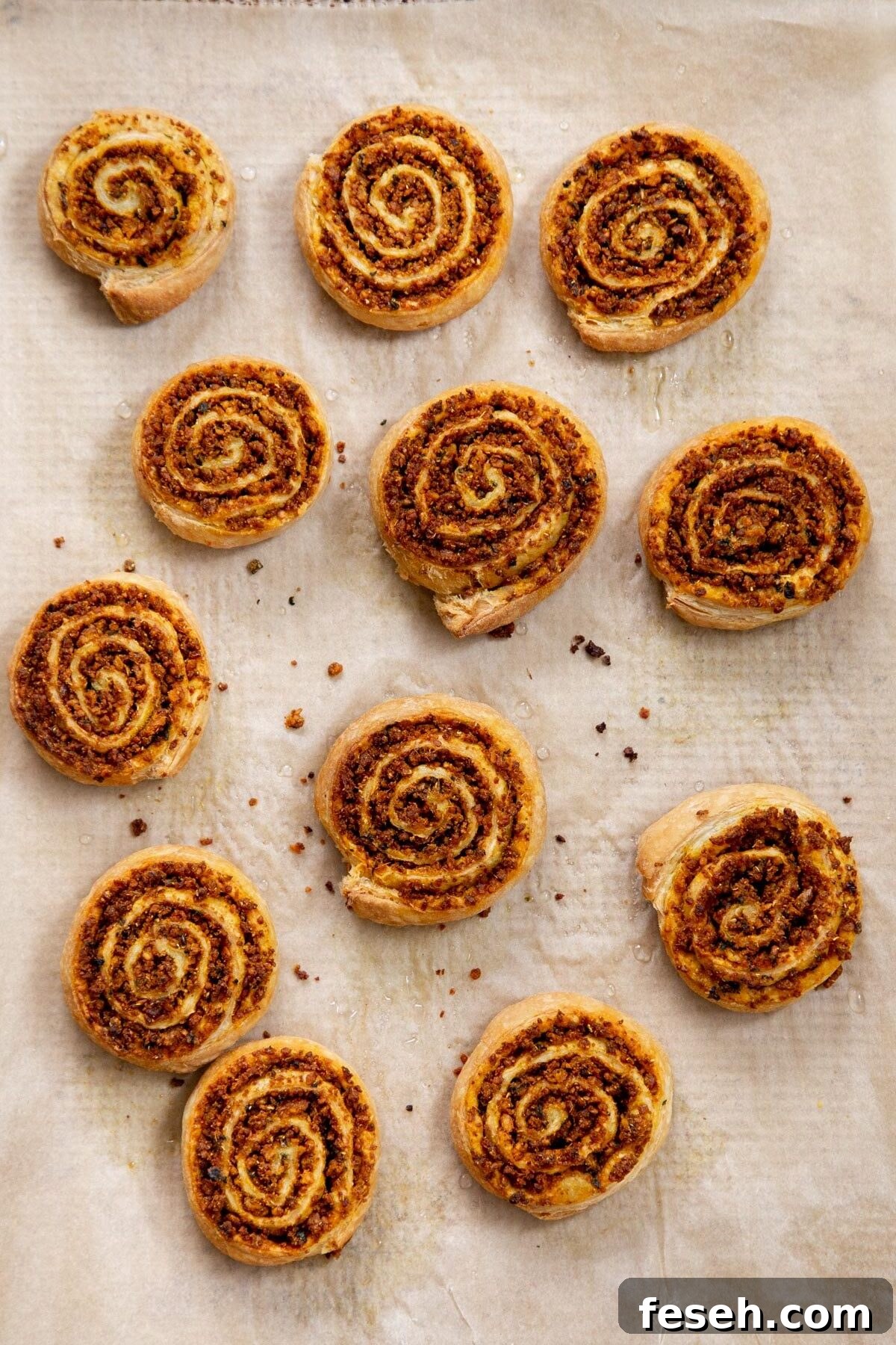 vegan pinwheels on a sheet of parchment paper