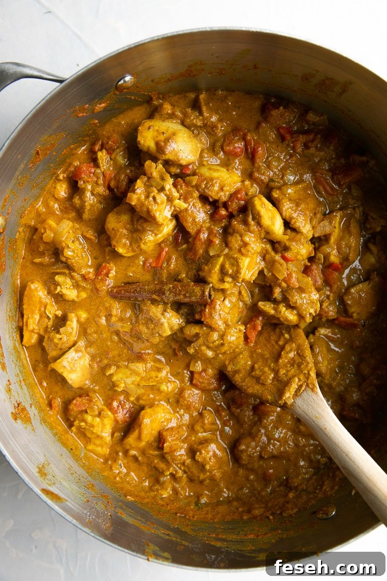 Butter Chicken being cooked in a large pot.