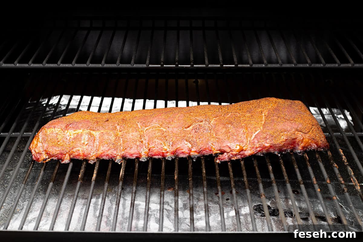 A rack of ribs in a wood pellet grill.