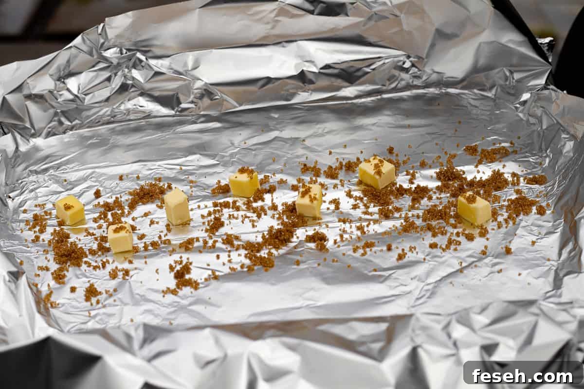Tin foil with cubes of butter and brown sugar.