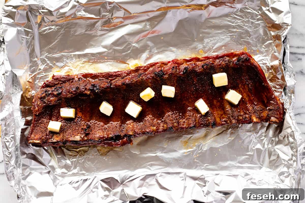 Baby back ribs butter, brown sugar, and fruit juice on top. 
