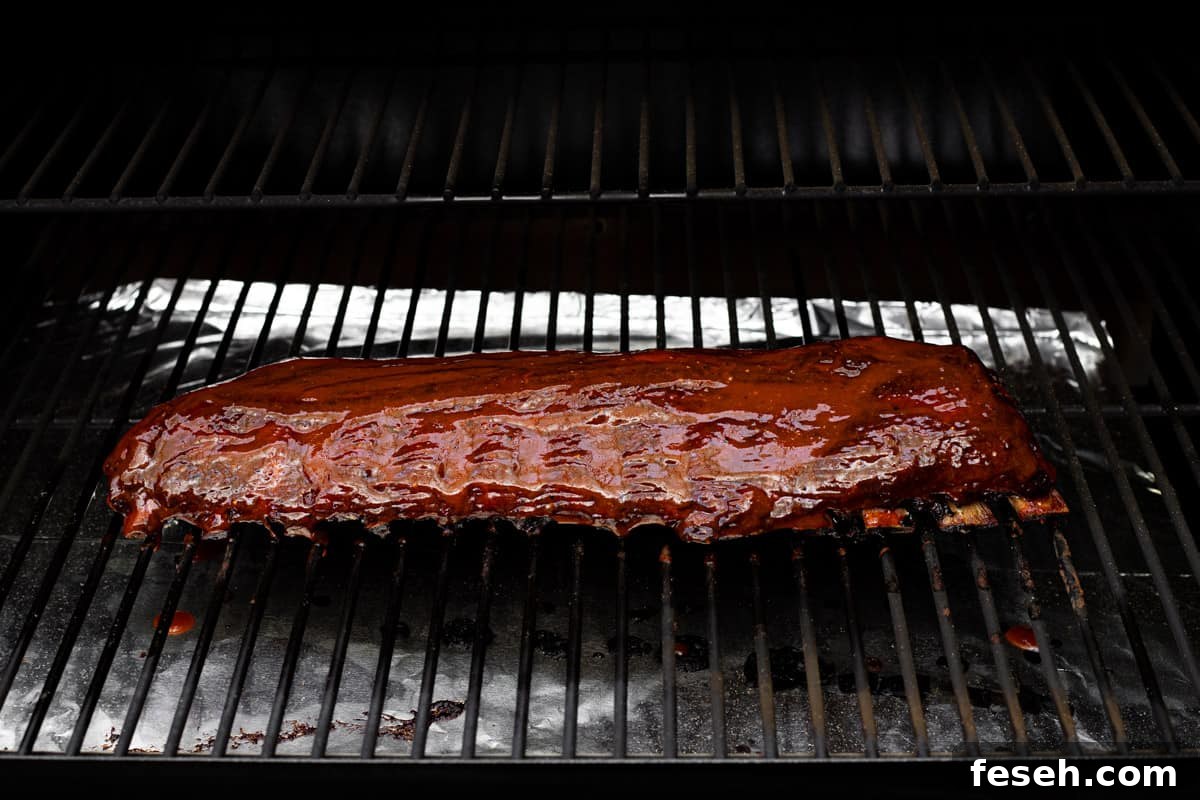 BBQ smoked baby back ribs on a wood pellet grill.