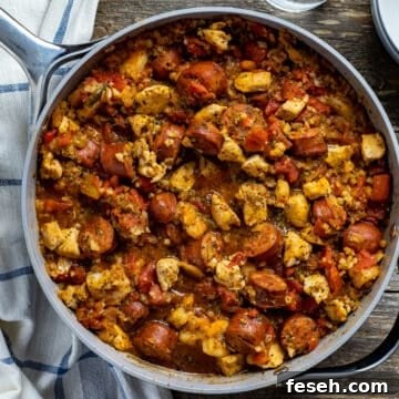 cooked jambalaya in pan on wooden table