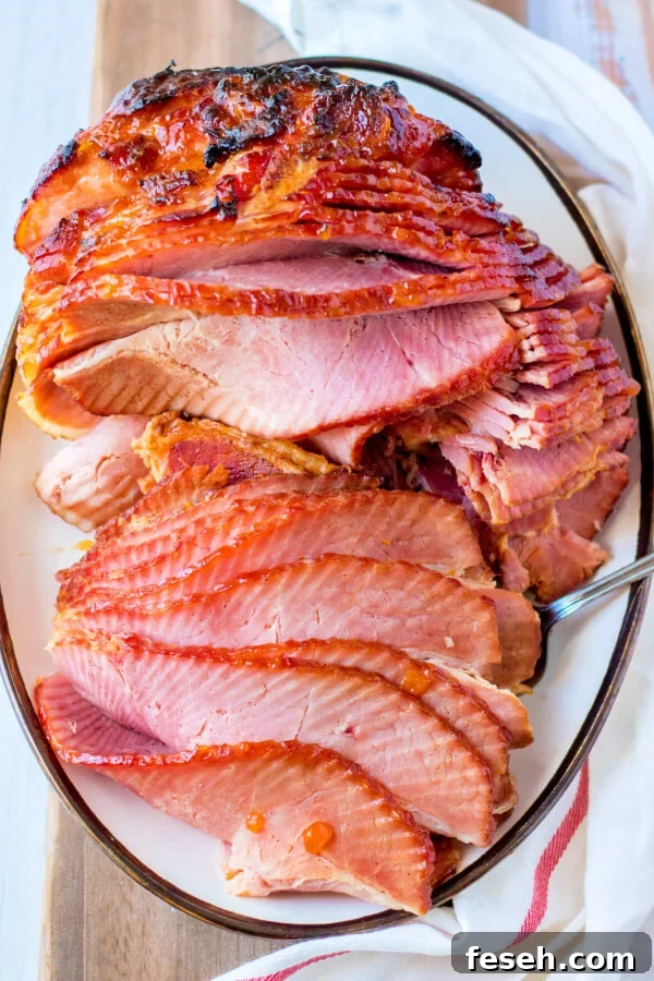 looking down onto a platter with apricot dijon spiral ham