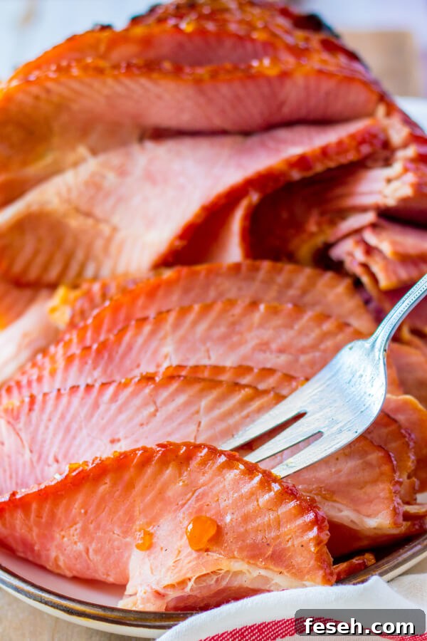 fork picking up a slice of ham