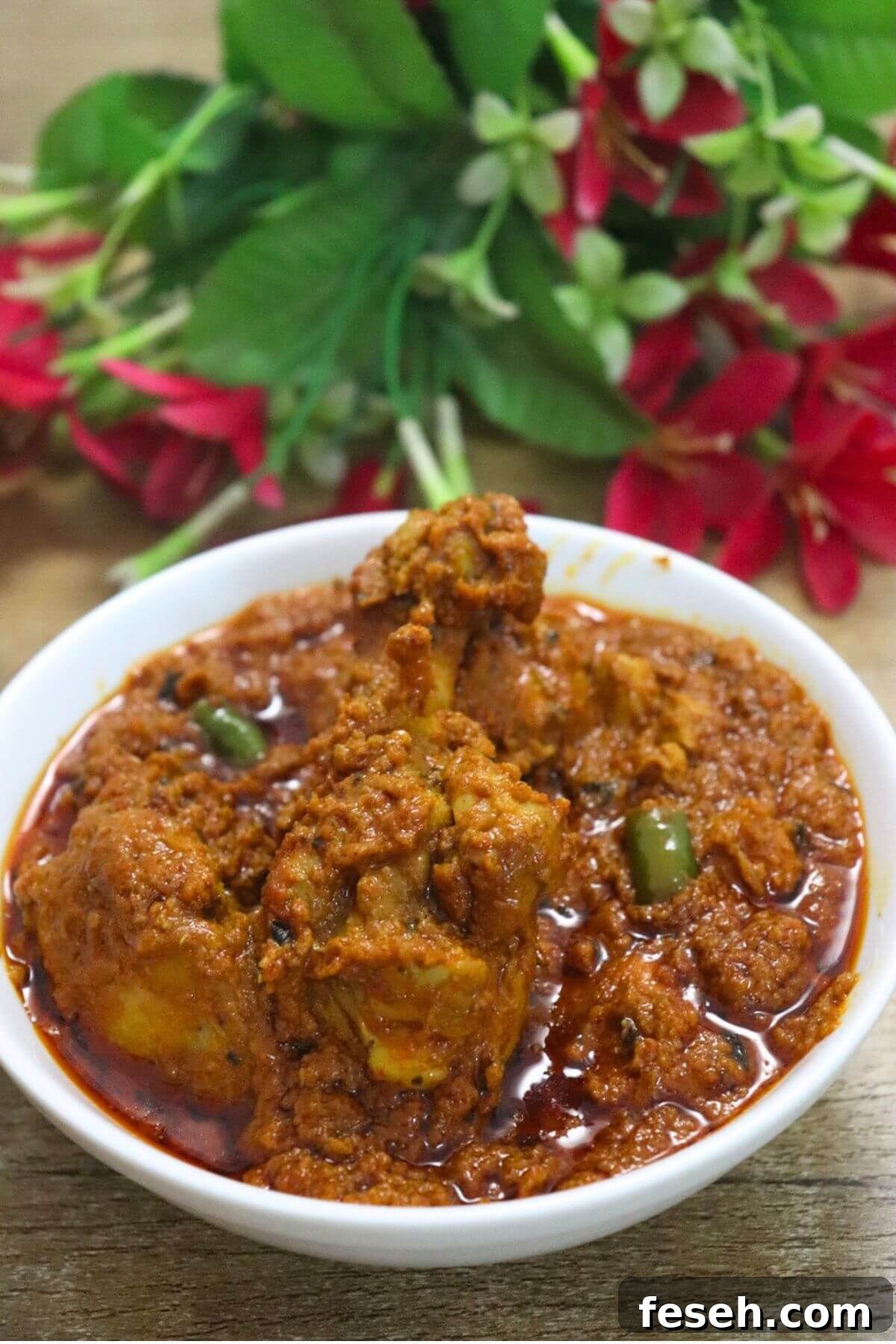 chicken changezi served in a white bowl.