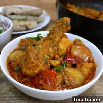 chicken dopiaza served in a white bowl.