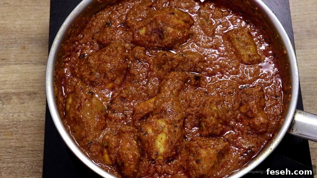 chicken changezi curry in a pan.