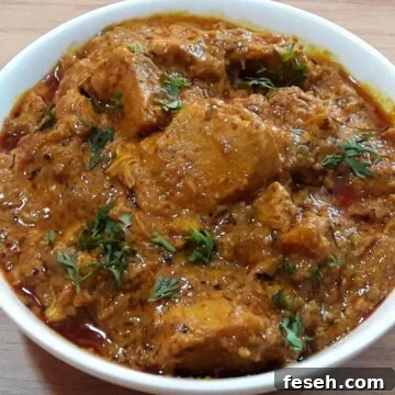 dahi chicken in a white color bowl.