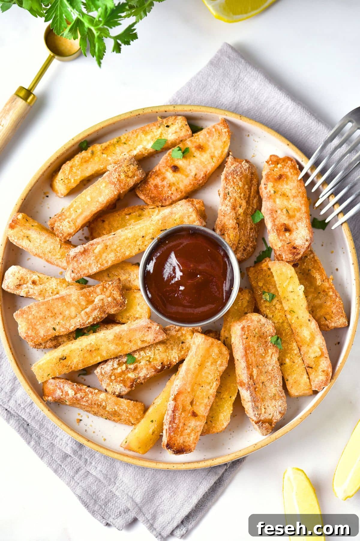 A plate of air fryer halloumi fries with bowl of ketchup.