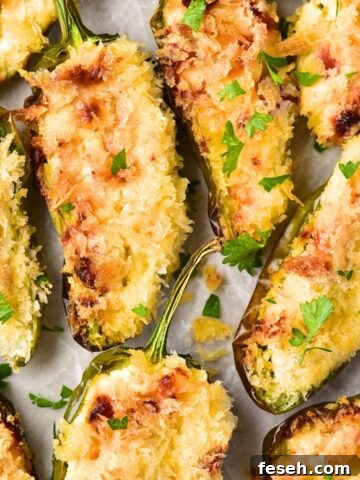 Top down view of gluten-free jalapeño poppers on parchment.