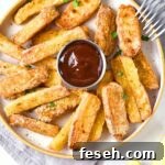 A plate of halloumi fries and dipping sauce.