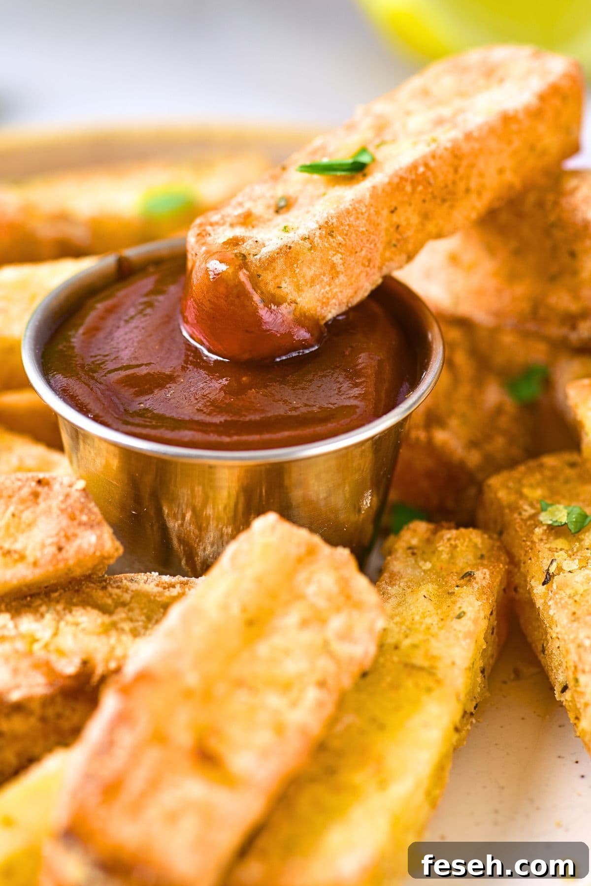 Dipping halloumi fry in ketchup