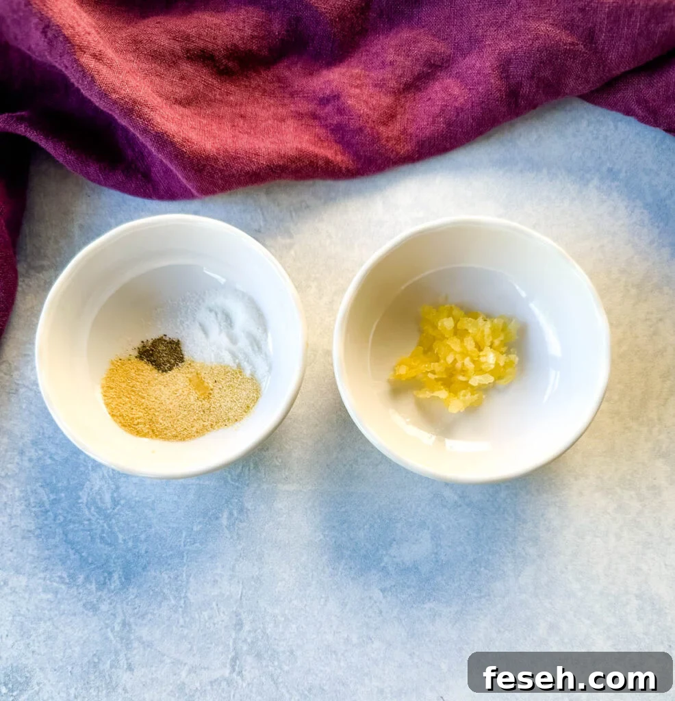 minced garlic and spices in separate white bowls
