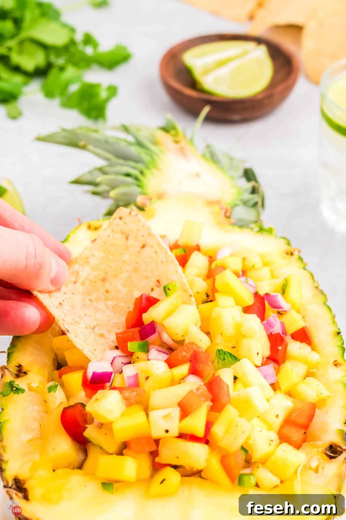 easy pineapple mango salsa recipe in a pineapple bowl