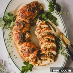 Overhead image of a sliced stuffed turkey on a serving platter.