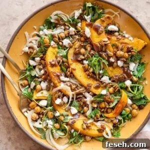 Close up of pumpkin salad on a yellow plate.