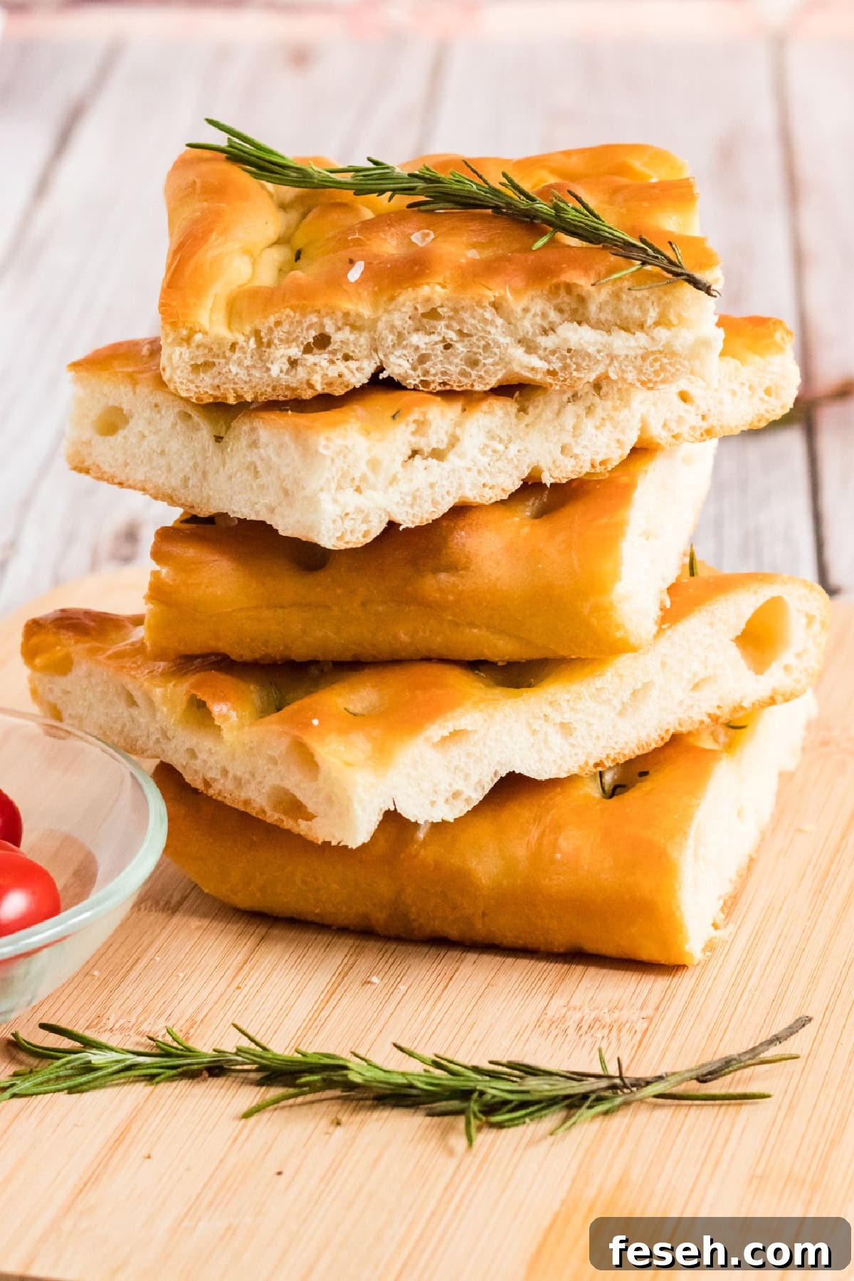 Focaccia Bread stacked on a cutting board